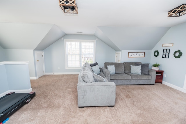 carpeted living room with vaulted ceiling