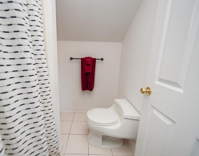 bathroom with tile patterned flooring and toilet