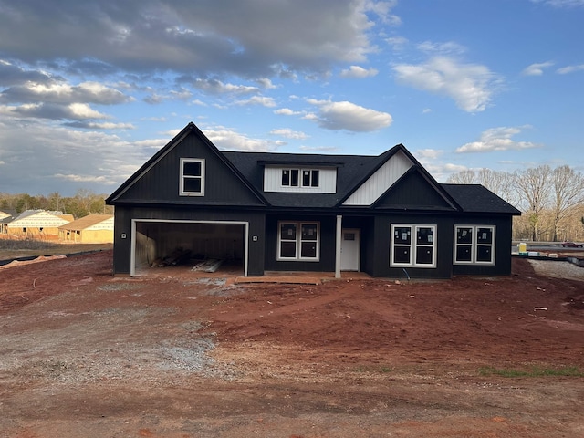 view of front of property featuring covered porch and driveway