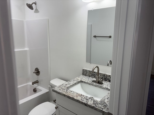 full bathroom with vanity, shower / bath combination, and toilet