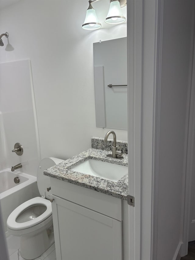 full bathroom featuring shower / bathing tub combination, vanity, and toilet