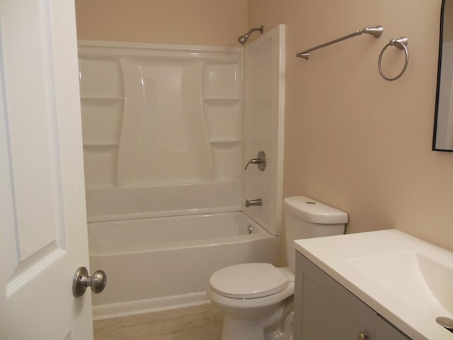 full bathroom with shower / tub combination, vanity, and toilet