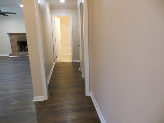 hall with dark wood-type flooring