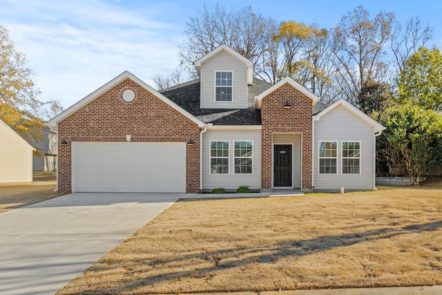 view of front of home with a garage and a front lawn