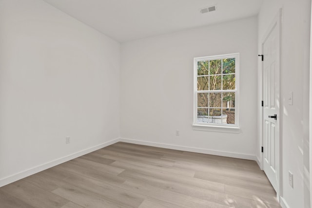 unfurnished room featuring light hardwood / wood-style floors