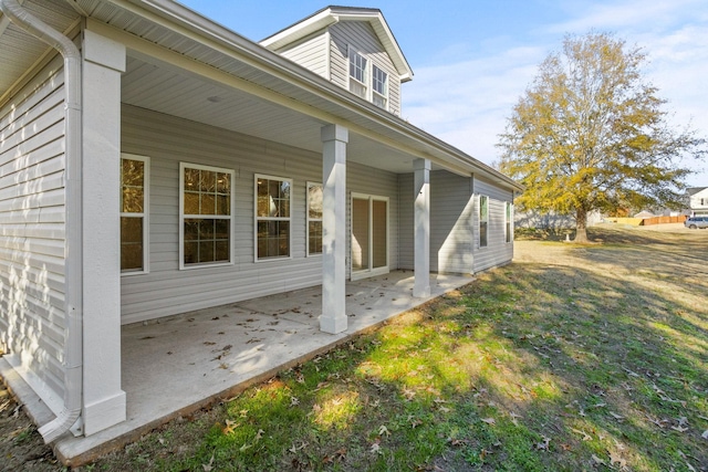 view of side of property with a patio