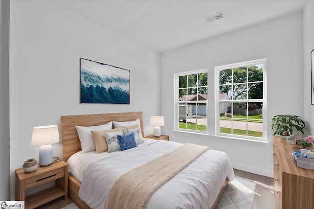 bedroom with wood-type flooring