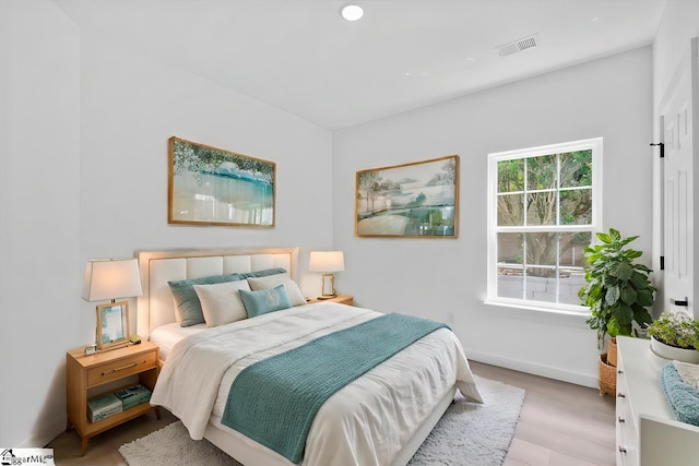 bedroom with light hardwood / wood-style flooring