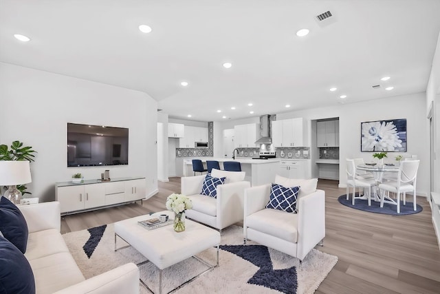 living room featuring light wood-type flooring