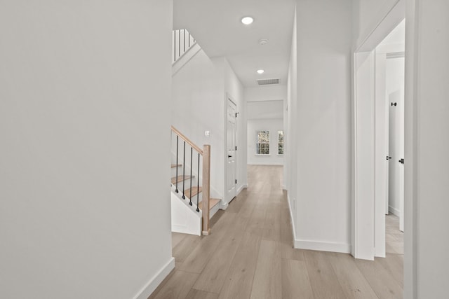 hall with light hardwood / wood-style floors