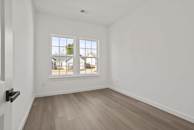 unfurnished room featuring light hardwood / wood-style floors