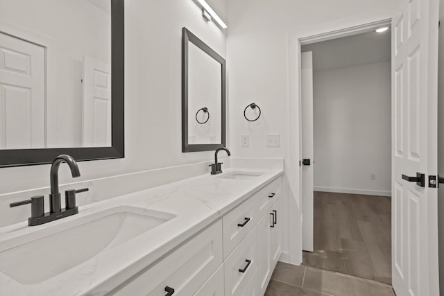 bathroom with hardwood / wood-style floors and vanity