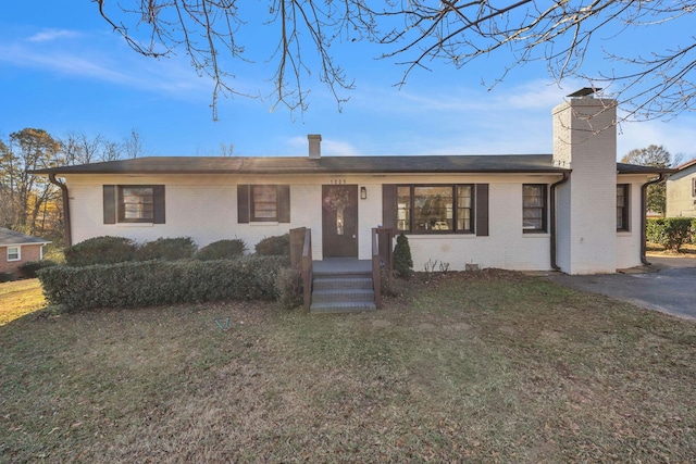 ranch-style house with a front yard