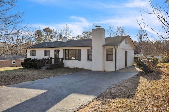 ranch-style home with a garage