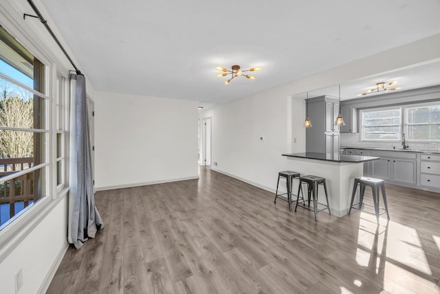 living room with sink and light hardwood / wood-style floors