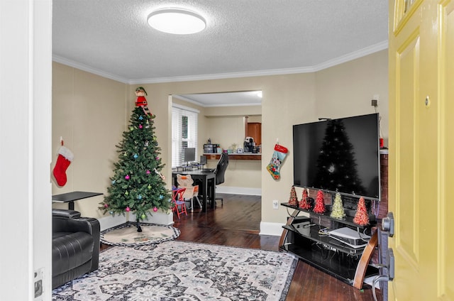 living room with a textured ceiling, dark hardwood / wood-style floors, and ornamental molding