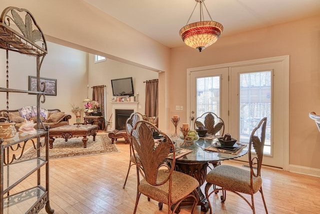 dining space with light hardwood / wood-style floors