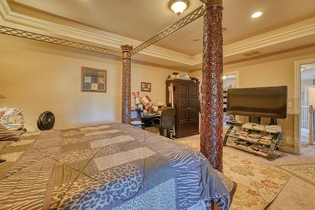 bedroom with carpet floors, a tray ceiling, and ornamental molding