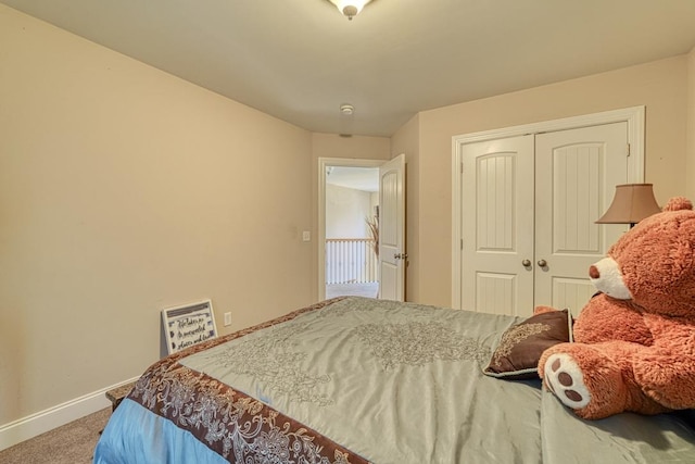 carpeted bedroom with a closet