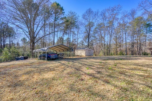 view of yard featuring a shed and a carport