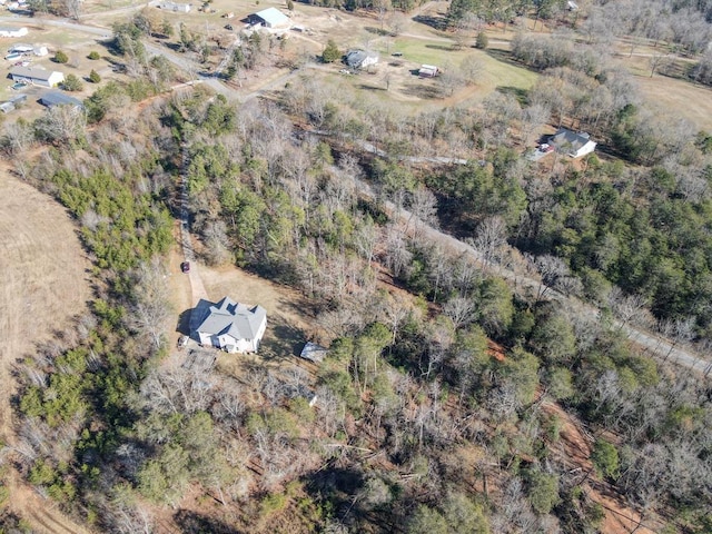 birds eye view of property with a rural view