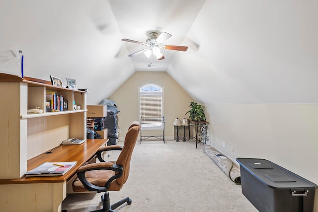 carpeted office space with ceiling fan and lofted ceiling