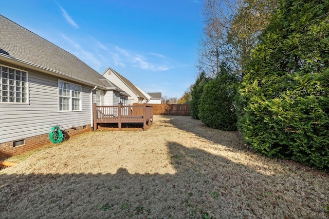 view of yard with a wooden deck