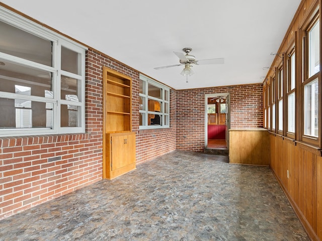 interior space with ceiling fan and a healthy amount of sunlight