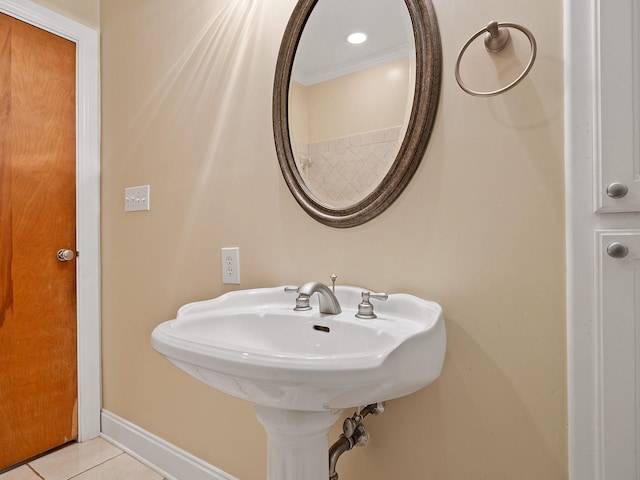 bathroom with tile patterned floors and crown molding