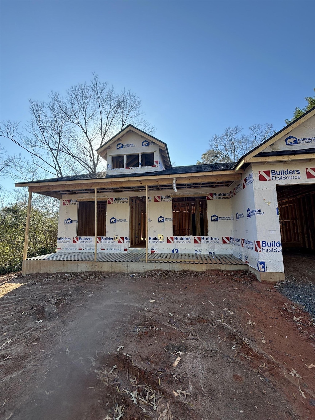 property in mid-construction with covered porch