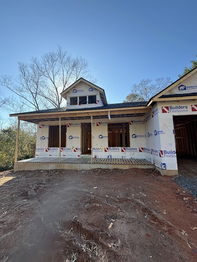 property in mid-construction with covered porch