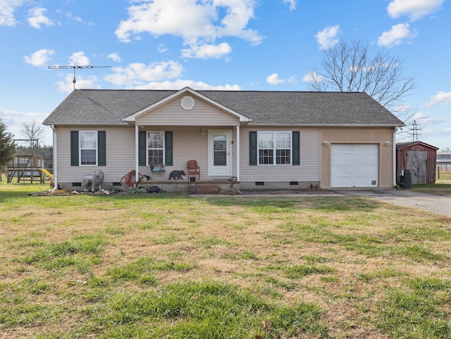 ranch-style house with covered porch, a garage, and a front lawn