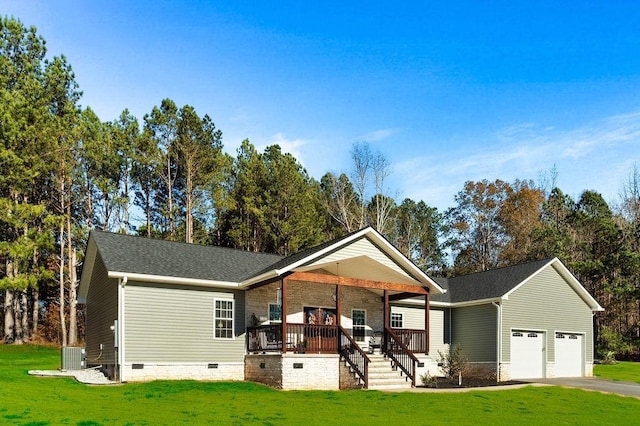 view of front of house featuring a garage, a porch, central AC, and a front lawn