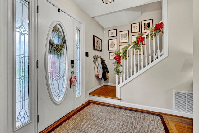 foyer entrance with wood-type flooring