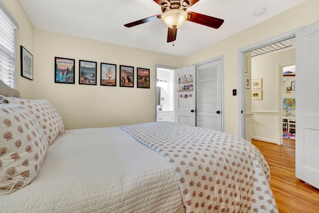 bedroom with ceiling fan and light hardwood / wood-style floors