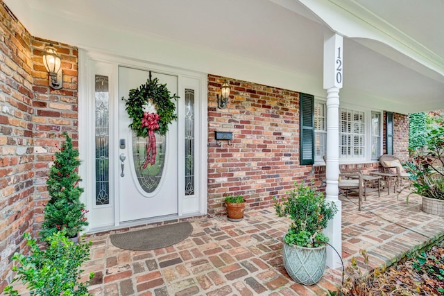 doorway to property featuring covered porch