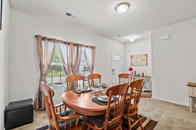 view of carpeted dining area