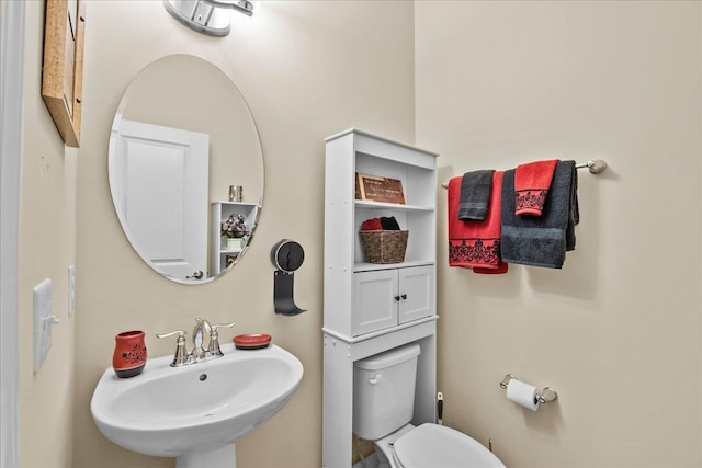 bathroom with toilet and sink