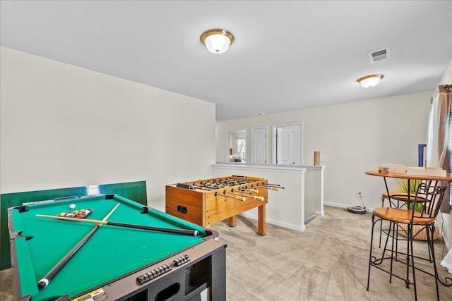 game room featuring light carpet