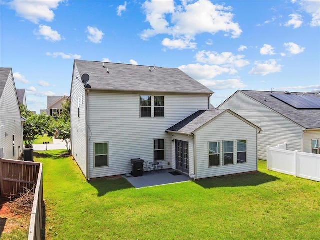 back of property with a lawn, a patio area, and central air condition unit