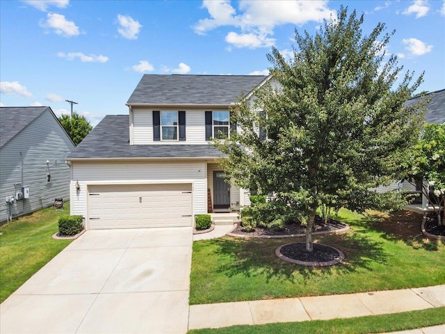 view of front of house with a front lawn and a garage