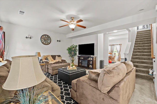 living room with carpet and ceiling fan