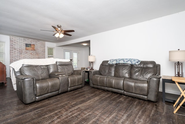 living room with ceiling fan, dark hardwood / wood-style flooring, and french doors