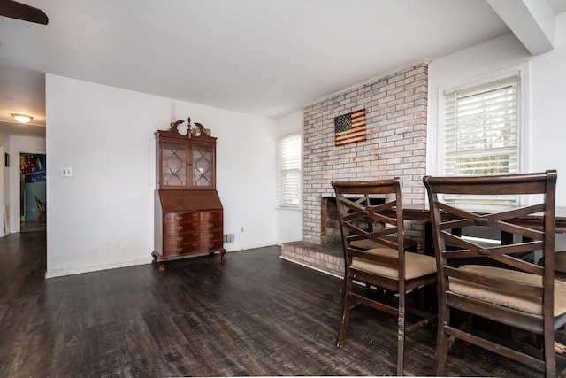 dining space featuring dark wood-type flooring