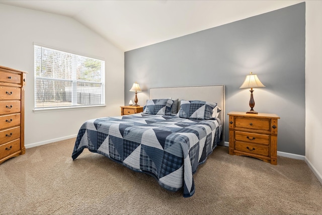 bedroom featuring carpet flooring and vaulted ceiling