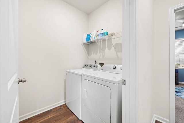 laundry room featuring washer and clothes dryer and dark hardwood / wood-style floors