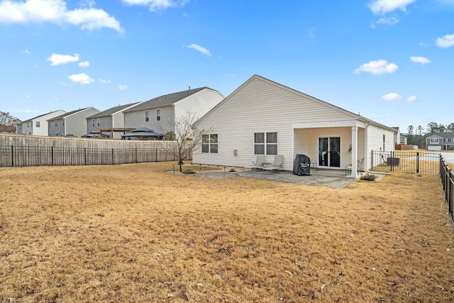 rear view of house featuring a patio