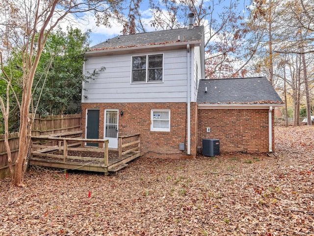 back of property featuring cooling unit and a deck