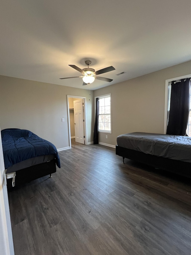 bedroom featuring ceiling fan, dark hardwood / wood-style flooring, and billiards