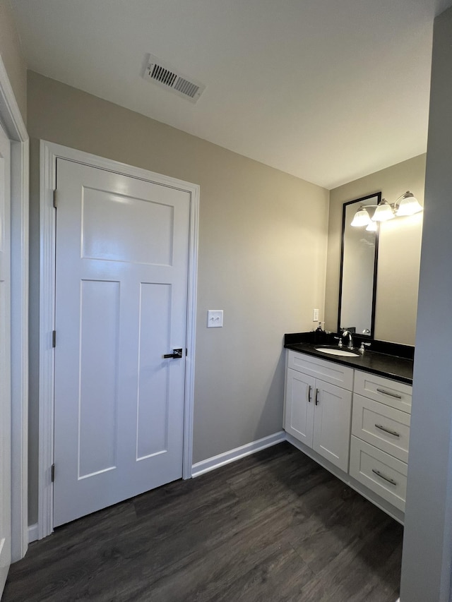 bathroom featuring vanity and hardwood / wood-style flooring